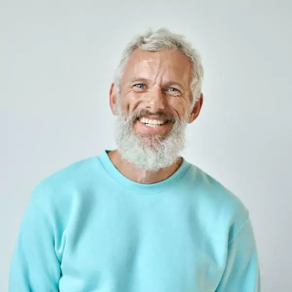 Older man in teal shirt